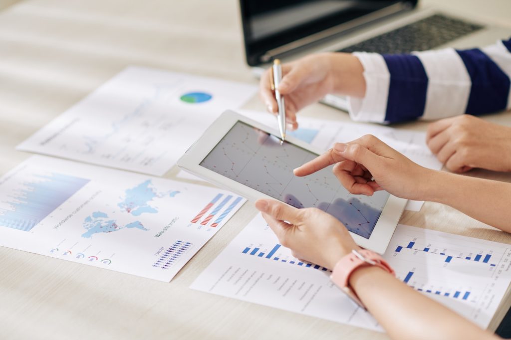 Businesswomen working on annual report